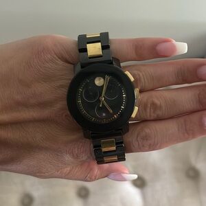 Movado black and golds woman’s watch